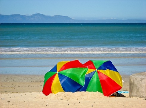 Umbreallas on an empty beach